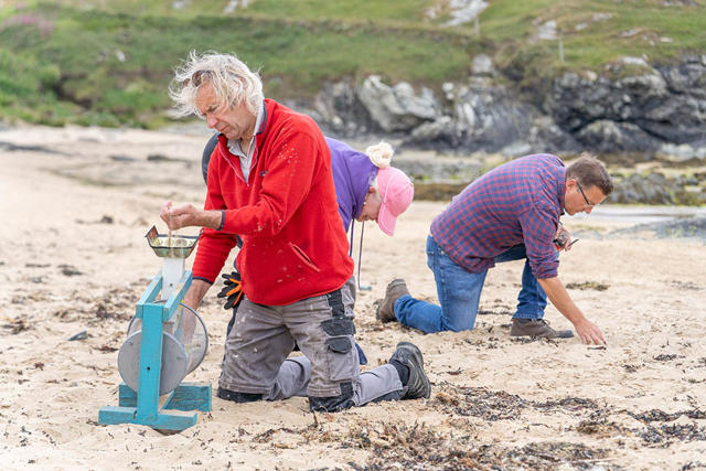 Volunteers looking for nurdles and small plastic on the beach