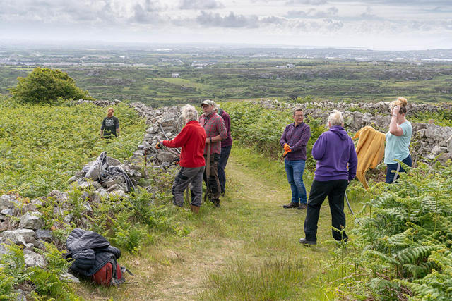 Volunteers preparing to clear bracken and overgrowth 