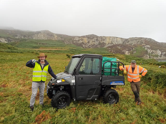 Officers removing overgrowth from site 