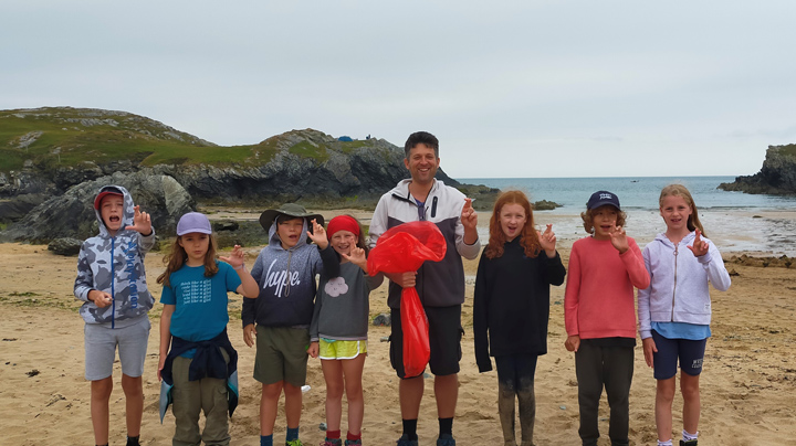 School pupils at Porthdafarch beach taking part in a nurdle hunt
