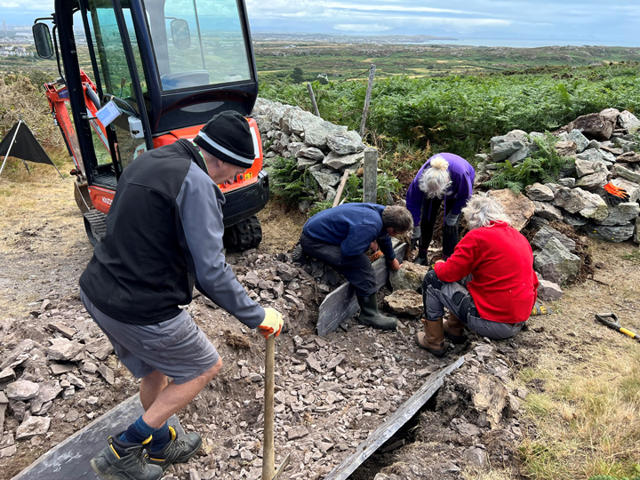 Volunteers creating the foundation for the water break