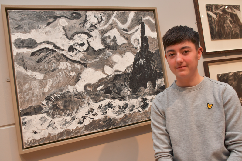 Zack Robinson with his winning art piece in the student category.