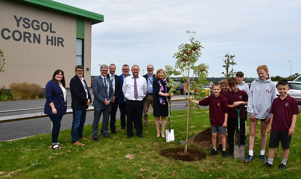 School children from Ysgol Corn Hir planting a tree