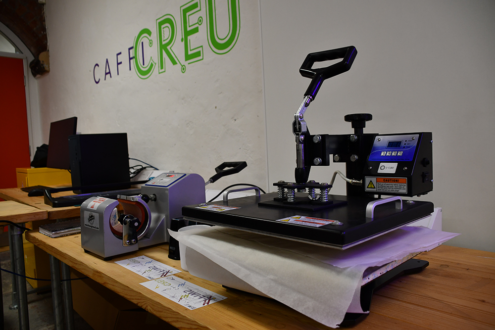 A heat press at the Ffiws Creation Café