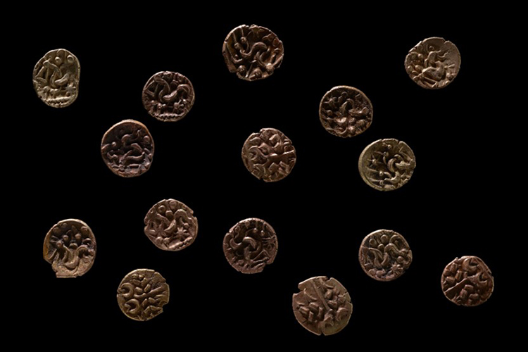 Ancient coins on a black background