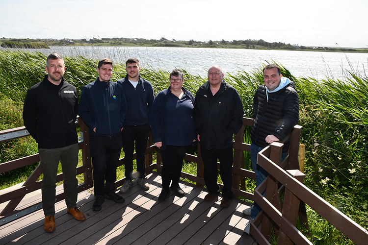 Photo (left to right): Emlyn Roberts (AE & AT Lewis), Wiliam Stockwell (Senior Project Officer), Tom Lovelock (AE & AT Lewis), Emma Roberts (Llanfaelog Community Council), Councillor Neville Evans, Councillor Douglas Fowlie)