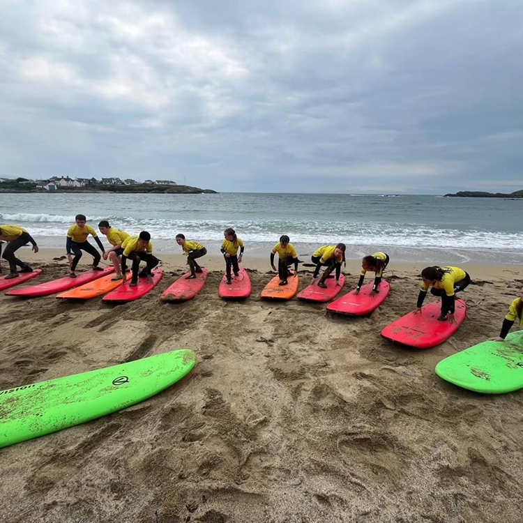 Children learning to surf.