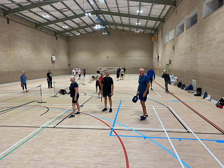 Group of people playing pickleball